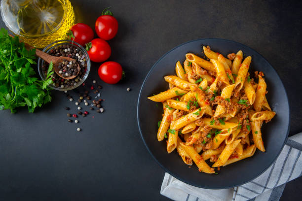 istock Penne pasta with minced meat and tomato sauce 2191499830