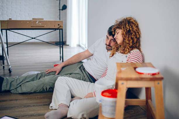 istock Couple taking a break from painting their house 2191504570