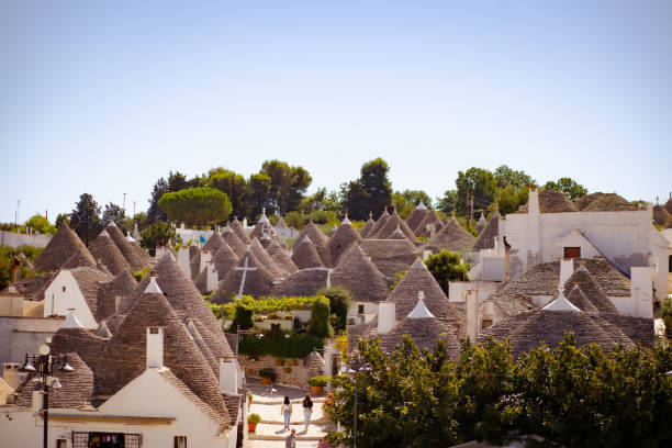 istock Many typical cone shaped Trulli houses on Alberobello skyline, Italy 2191505823