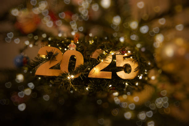 istock Horizontal Golden 2025 with bokeh ornament on a decorated Christmas tree 2191511232