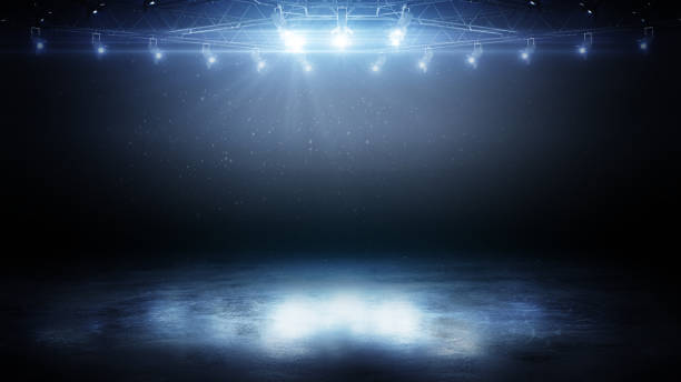 istock 3D empty ice rink illuminated by spotlights. Ice with deep cracks. 3D beautiful ice background. Realistic ice and snow on dark background 2191511415