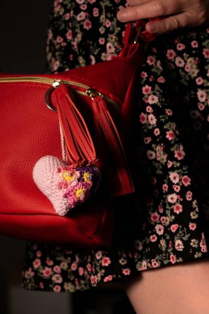 istock Red handbag with floral crocheted heart accessory 2191512253