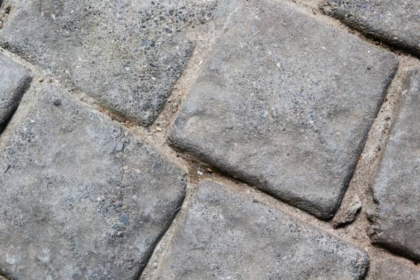 istock Rough Stone Paving Texture with Closeup of Concrete Surface Pattern 2191512546