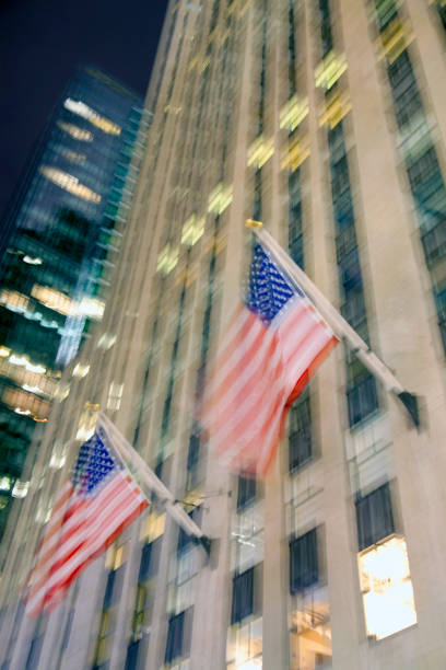 istock New York office towers w ith American flags 2191512953