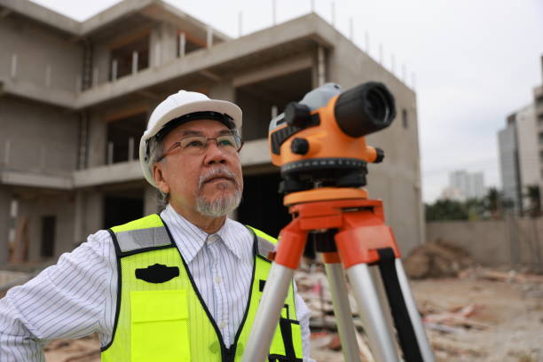 Surveyor working at new construction site