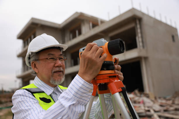 Surveyor at mine with theodolite