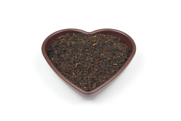 istock Dry black tea leaves isolated on white background, top view 2191513389