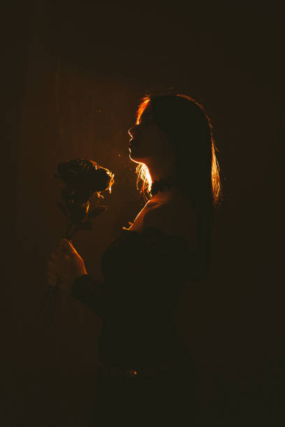 Young and beautiful Ukrainian woman posing profile with dramatic light