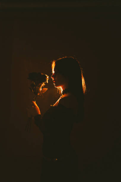 Young and beautiful Ukrainian woman posing profile with dramatic light