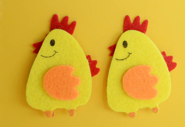 two cute yellow felt chickens handmade, diy, kids easter crafts, copy space, funny handmade idea.