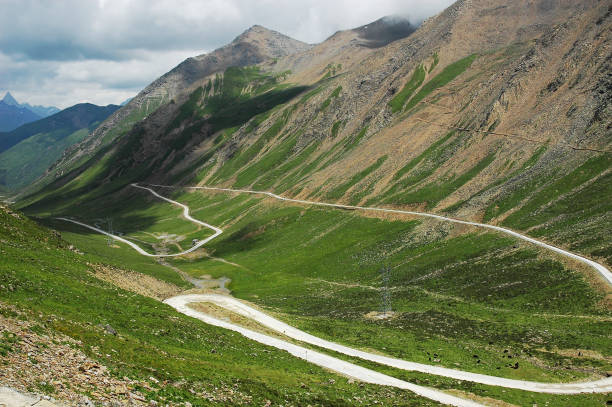 istock winding road expanding in mountain valley 2191518398