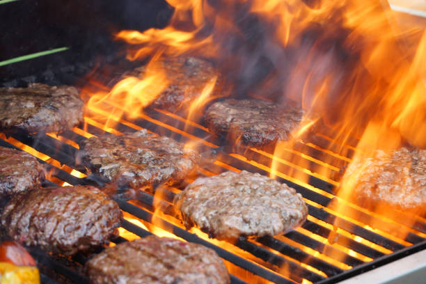 barbecue grill cooking burger steak on the fire