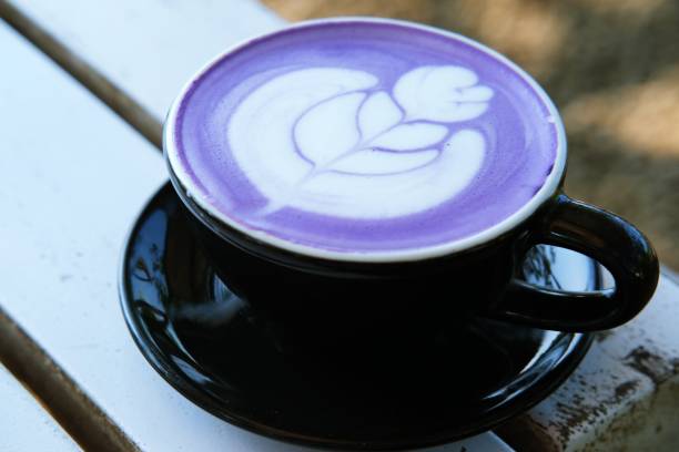 istock A beautiful purple latte with intricate latte art in a black cup. 2191520439