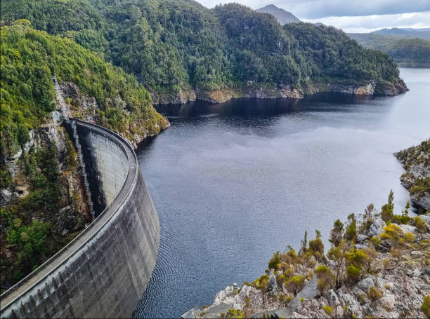 istock Gordon Dam in Tasmania, an impressive concrete structure surrounded by rugged cliffs and a lake in a remote wilderness 2191521285