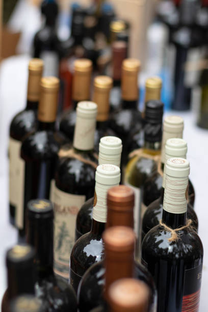 istock display of wine bottles with white and gold colored necks in a row 2191523092