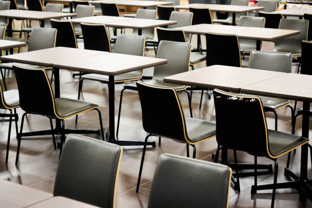 Neatly arranged monochrome tables and chairs.