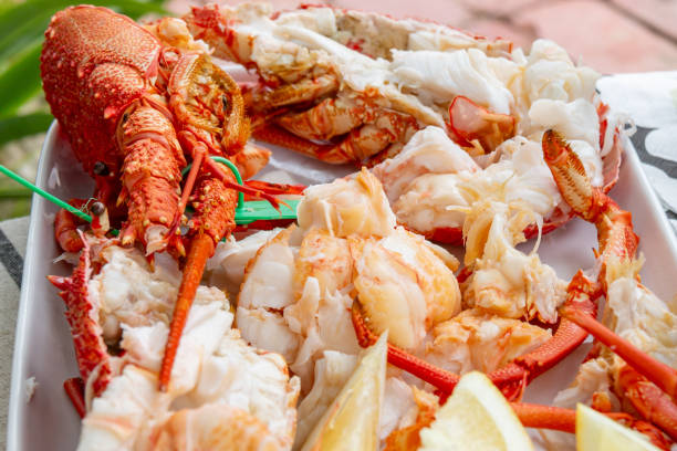 istock boiled lobster served with lemon wedges 2191525725