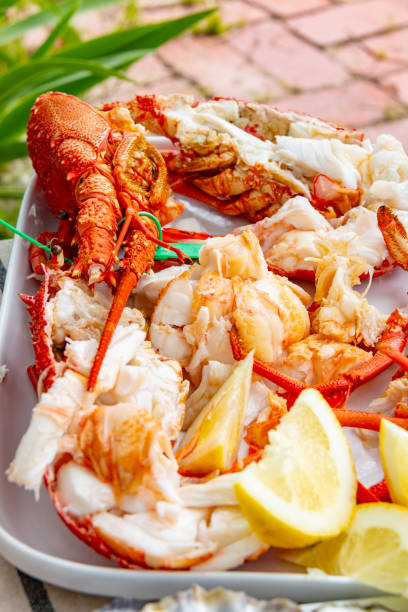 istock boiled rock lobster crayfish served with lemon wedges on a platter 2191525732