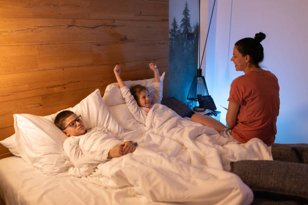 istock Mother taking child's temperature with thermometer 2191526262