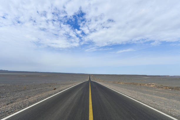 istock Desert road sand dunes in Xinjiang, China 2191526731