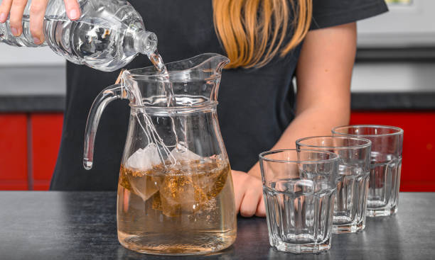 istock A waitress in a restaurant prepares a cold drink, cold tea, iced tea 2191534331