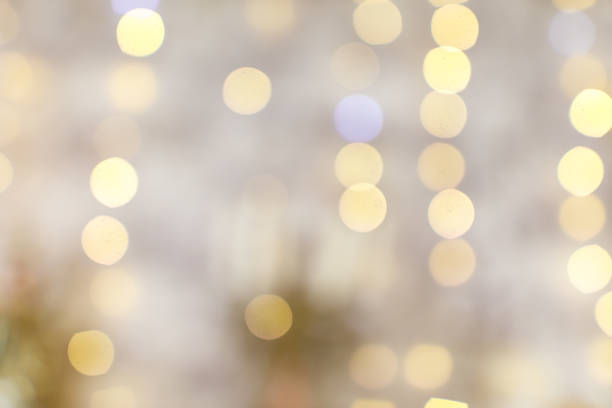 istock The image is a blurry, yellowish background with many small, bright 2191534405