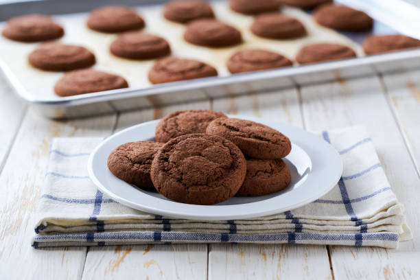 istock Delicious chocolate brownie cookies on a light kitchen table, selective focus. 2191538880