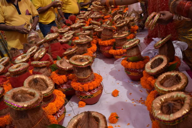 istock Kalash with coconut and mango leaf with floral decoration earthen pots containing sacred water. Kalash for hindu puja during Jagannath Temple Mangal Kalash Yatra, front view, closeup 2191539348