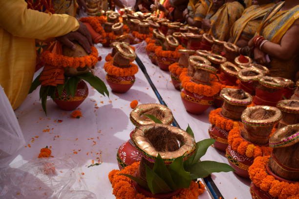 istock Kalash with coconut and mango leaf with floral decoration earthen pots containing sacred water. Kalash for hindu puja during Jagannath Temple Mangal Kalash Yatra, front view, closeup 2191539388