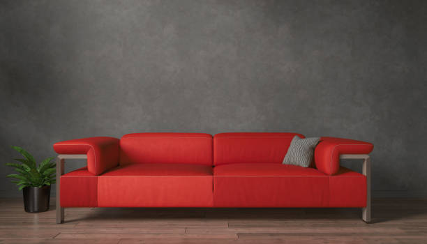 istock 3d rendering of a black mock up wall with red sofa. 2191540980