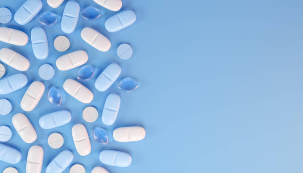 istock 3d rendering of some blue and white tablets, pills. 2191541036