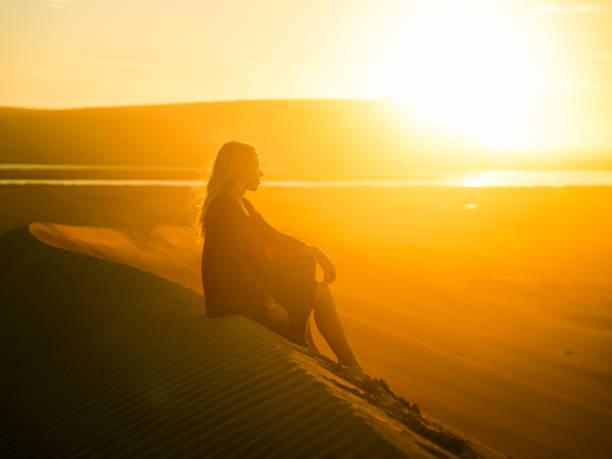 istock Serene Caucasian Girl Enjoying Sunset on Sandy Beach 2191543033