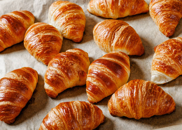 istock freshly baked in oven croissants on a sheet pan 2191544746