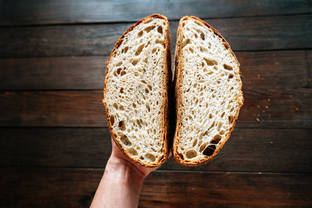 istock Open Crumb Artisan Sourdough Bread, Cut in Half 2191545058