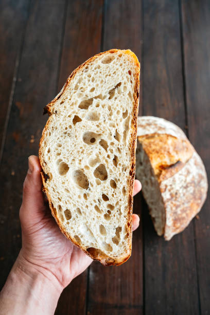 istock Open Crumb Artisan Sourdough Bread, Cut in Half 2191545063