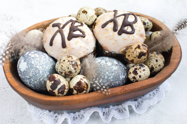 Rustic Easter, quail eggs in a wooden bowl on the table. The Bright Easter Holiday