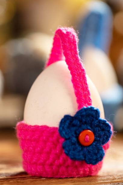 istock Single egg in a bright crochet basket with a flower 2191548777