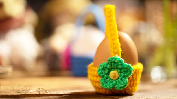 istock Bright crochet egg basket with green floral accent 2191548792