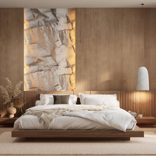 istock A modern bedroom featuring a wooden bed, soft bedding, warm lighting, and a textured wall, creating a calming and inviting atmosphere. 3d rendering. 2191549100