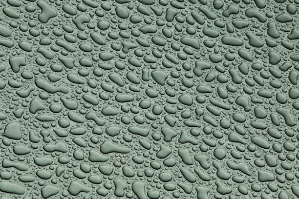 Beige plastic background with water drops