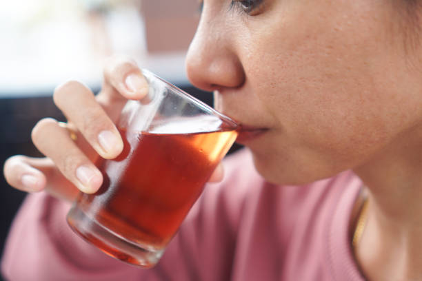 istock close up woman drinking roselle tea 2191551202