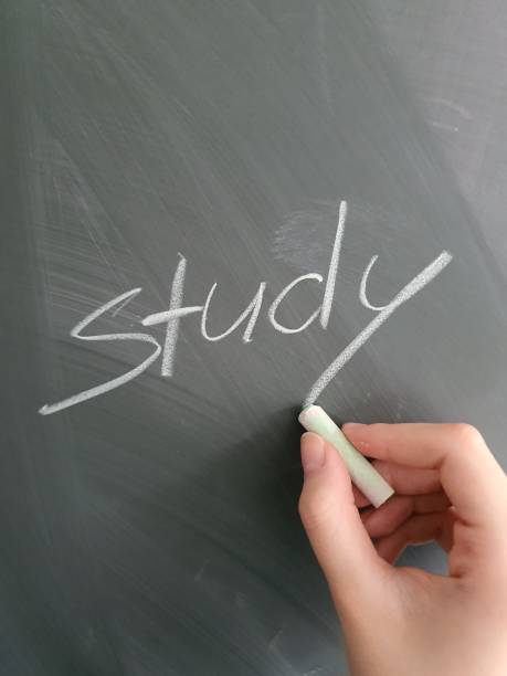 istock Student writing the words Study to a chalkboard at schoo 2191552262