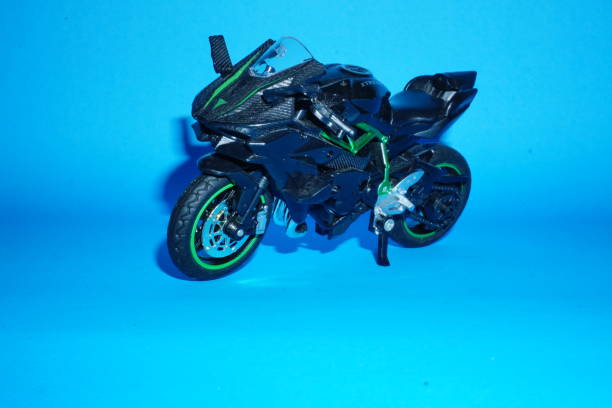 Black sport bike parked on blue background