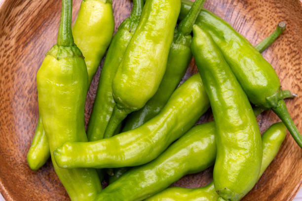 istock Green peppers on wooden table 2191554445