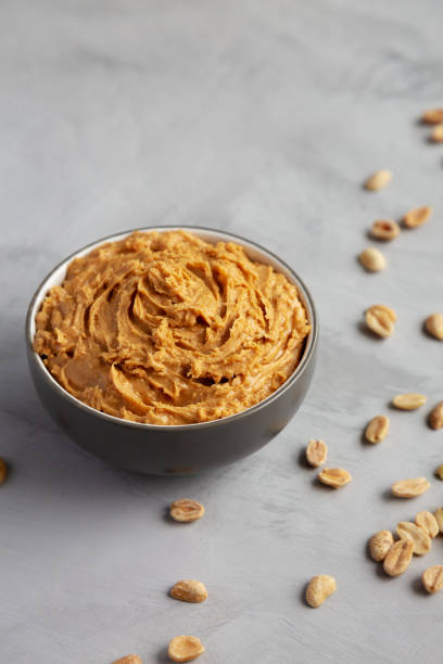 istock Yummy Organic Peanut Butter in a Bowl, low angle view. Copy space. 2191554553