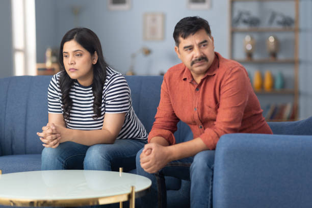 istock Couple with problems in communication sitting on sofa at home stock photo 2191557177
