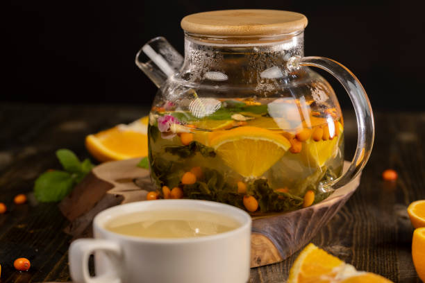 istock tea with orange and ripe sea buckthorn berries 2191565166