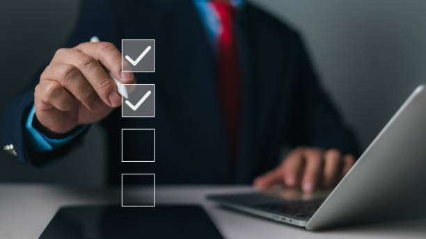 istock Businessman using stylus pen doing online checklist survey, Business performance checklist,Filling out digital form checklist, Take an assessment, Questionnaire, Evaluation, Survey, Checkmarks 2191568408