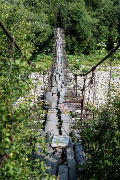 Old suspension bridge over the river, Carpathian Mountains, Ukraine