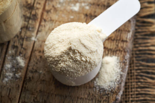 istock Whey protein powder in a white measuring cup 2191570477